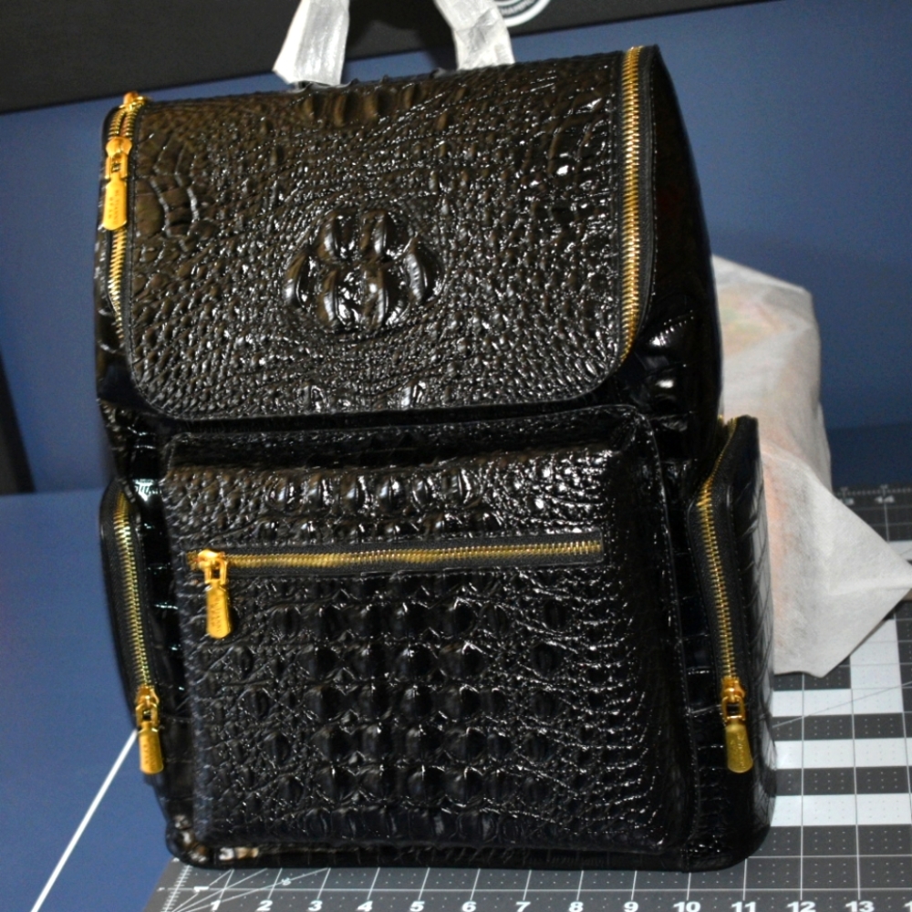 Black crocodile print backpack